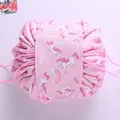 Pink drawstring makeup bag with cartoon unicorn pattern and secure velcro flap cover - Dreamy Rainbow Unicorn