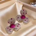 Silver clover stud earrings featuring a red oval gemstone with white pavé diamonds - Red Main Stone Clover Geometric Style (Silver Needle)
