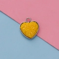 Macro shot of 13mm heart pendant with yellow textured resin and silver metal frame - Yellow Textured Style(20)