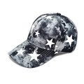 Detail view of tie-dye baseball cap featuring white star patterns and curved brim - M (56-58cm) / Black