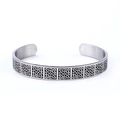 Silver stainless steel open cuff bracelet with black Celtic knot engraving on white background - Square Celtic Pattern Style (AB0607)