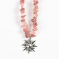 Pink strawberry crystal chip necklace with a silver sun pendant on white background - Strawberry Quartz Sun