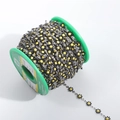 DIY black daisy flower 18K gold plated stainless steel chain on green plastic spool - Steel + Black