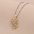 Macro shot of two-tone letter R pendant with sparkling rhinestones and golden texture - Letter R
