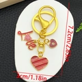 Detailed size view of red enamel Love heart keychain with gold finish measurement indicators - Red Glitter LOVE Heart Style (ER1284)