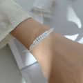 Elegant silver bracelet with alternating clear square and round zircon stones - Single Row White