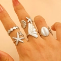 Adjustable silver stainless steel ring set featuring starfish and seashell designs - Stainless Steel Ring Set of 5