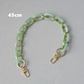 Detail view of a 45cm light green resin chain strap with elegant golden metal ring links - 45cm / Green