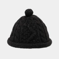 Détail du bonnet en maille torsadée noire avec fils argentés et pompon au sommet - Taille unique / Noir