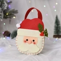 Detail of felt Santa Claus gift bag with festive 3D accents and soft warm lighting - Chibi Santa