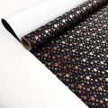 Large black gift wrapping paper roll with metallic gold star patterns and dots - Star