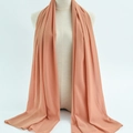 Elegant coral orange chiffon hijab scarf displayed on a mannequin for a flowing draped look - 48
