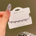 Detail of silver zircon bracelet on white card highlighting nickel-free jewelry craftsmanship - 14K Gold Plated Copper / Silver