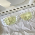 Stylish transparent rectangular sunglasses with light yellow lenses on white fabric - Jelly Square Yellow Lens