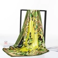 Elegant green silk scarf with floral paisley patterns draped on a black frame - 80-100cm / Green