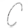 Close-up of silver C-shaped bamboo bead bracelet in polished stainless steel - 3-Bead Oval Bracelet / Silver
