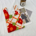 Knit tote bag featuring vibrant red and orange floral patterns with green leaves and mesh line - Red Small Flower