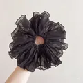 Detailed view of oversized black pleated chiffon scrunchie with layered ruffle texture - Large / Pleated Oversized-Black