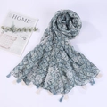 Detail of printed geometric scarf with soft blue diamond patterns and bicolor tassels - Style 24