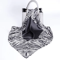 Satin silk scarf with black and white zebra stripes draped over a gray textured handbag - Black White Zebra