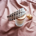 Detail of woven straw headband with geometric patterns on a scented candle aesthetic setting - Black Beige Khaki Tricolor Plaid