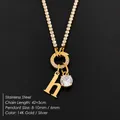 Gold stainless steel initial h necklace featuring a sparkling round rhinestone pendant - Letter H (XNL0103)