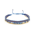 Detail view of multilayer Miyuki bead bracelets with geometric woven band and gold chain - Blue Geometric Cord + Blue Cut Beads