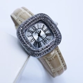 Close-up of a silver square watch featuring a Roman dial and beige leather strap - Light Yellow Silver Case