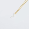 Minimalist gold chain necklace featuring a polished white cornicello horn pendant - White Chili