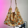 Detail of vintage floral canvas tote bag in orange and green with MAUD brand tag - Orange Large Flower