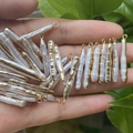 Baroque rectangle freshwater pearl pendants with gold plated edges held in hand - No.8 Width 4-6mm Length 20-40mm