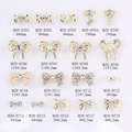 Selection of 18 golden metal bow nail art charms with pearls and rhinestones in various sizes - Gold Bow-9701(9701)