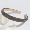 Detail of luxury rhinestone headband with dark sparkling crystals on a beige inner lining - Gray