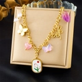 Gold chain necklace with butterfly heart charms and floral pendant on a jewelry box - Butterfly Dragonfly Pink Heart Pearl Style (N3421)