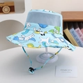 Dettaglio della maglia traspirante e stampe dinosauri su cappello estivo bimbo - 52cm (2-5 Anni) / Orso Polare Blu Chiaro