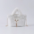 White faux fur handbag with golden reindeer horn buckle and chain shoulder strap - White