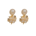 Elegant gold fireworks earrings with white pearls and sparkling zircons on white background - Gold