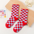 Checkerboard pattern crew socks in red and light blue contrast knit on a wooden tray - One Size / Blue Red