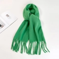 Flat lay macro detail of bright green mohair scarf featuring long fringe and soft texture - Scallion Green