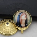 Detailed view of a vintage gold metal ornament featuring a Virgin Mary religious icon - Gold-3 (Vintage Virgin Mary)