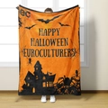 Halloween flannel blanket with castle and bat prints displayed by a standing model - Style 2-Orange Black Castle Bat