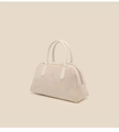 Macro detail of beige suede Boston bag featuring smooth leather handles and a zipper closure - Milky White