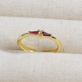 Elegant gold ring with square red gemstones and center zircon on beige fabric - Trapezoid Red Stones Center Stone Style (款式26)