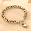 Bracciale a sfere in acciaio inossidabile con chiusura OT e ciondolo a cuore - Stile Cuore in Acciaio (I501)