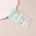 Close-up of pastel hair clip set with pearls and rhinestones on a white tray - B Style-Blue Collection