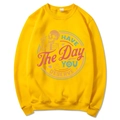 Yellow crewneck sweatshirt featuring a colorful skull print and graphic text - Yellow
