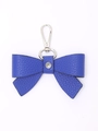 Blue leather bowknot keychain pendant with silver metal hook on a white background - Blue