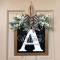 Letter A personalized wooden door sign with black bow and greenery for home decor - Letter A