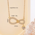 Collana dorata infinito e cuore con zirconi incastonati e dettagli misura - Oro