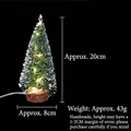 Mini lighted Christmas tree with snow-dusted needles and a natural wooden base, 20cm height - 20CM Christmas Tree with Warm Lights